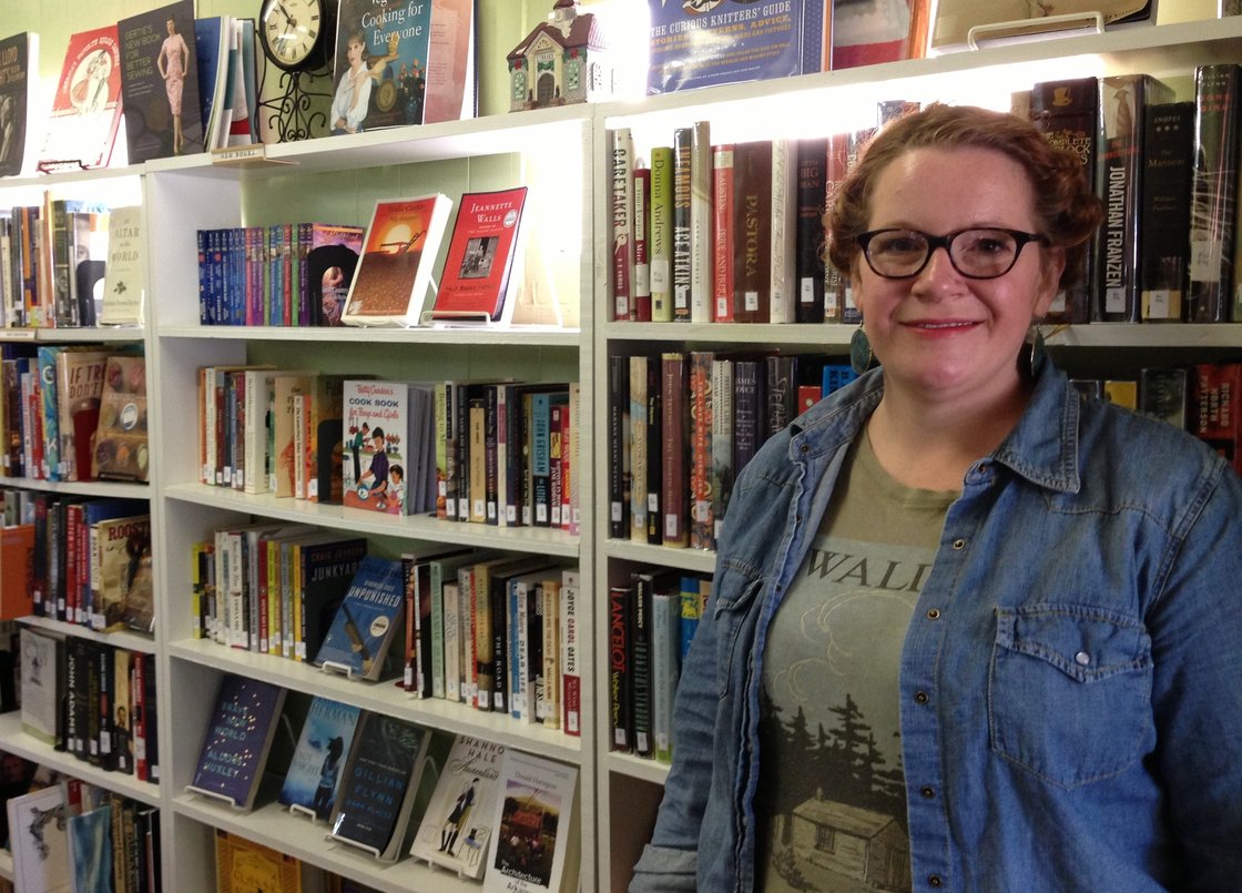 Rachel Reynolds in front of book shelves.
