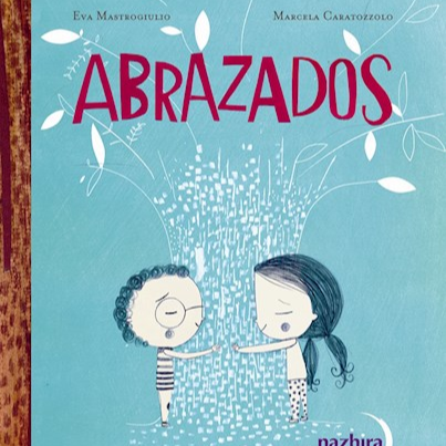 A light blue book cover with the title, "Abrazados," by Eva Mastrogiulio and Marcela Caratozzolo. There is a white tree in the center of the cover with two children hugging it; one boy with curly hair, glasses, and a striped shirt, and a girl with two pony tails and polka dotted pants.