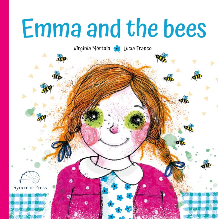 A white book cover with a blue plaid pattern lining the bottom, titled, "Emma and the bees," by Virginia Mortola and Lucia Franco. There is a girl with red hair in braids wearing a pink sweater with white polka dots and a white blouse with blue flowers in the center of the cover. She is smiling with a number of bees around her head.