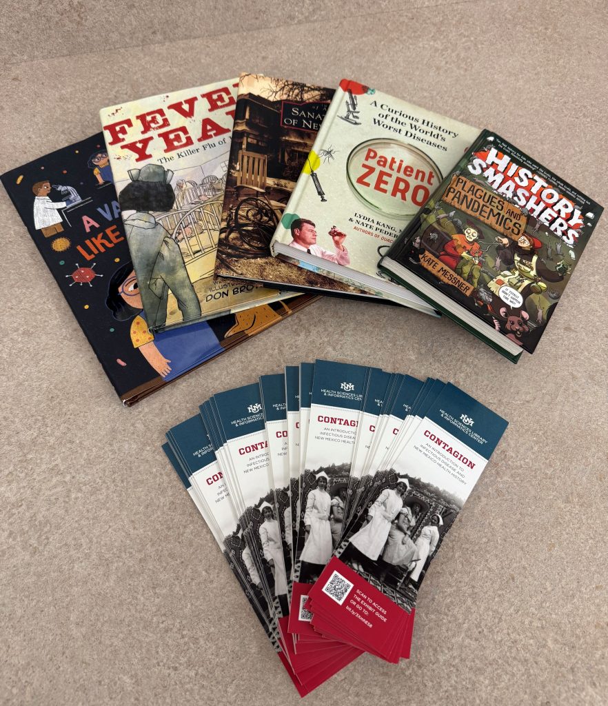 Books and pamphlets from the UNM Health Sciences Center book club and Contagion display