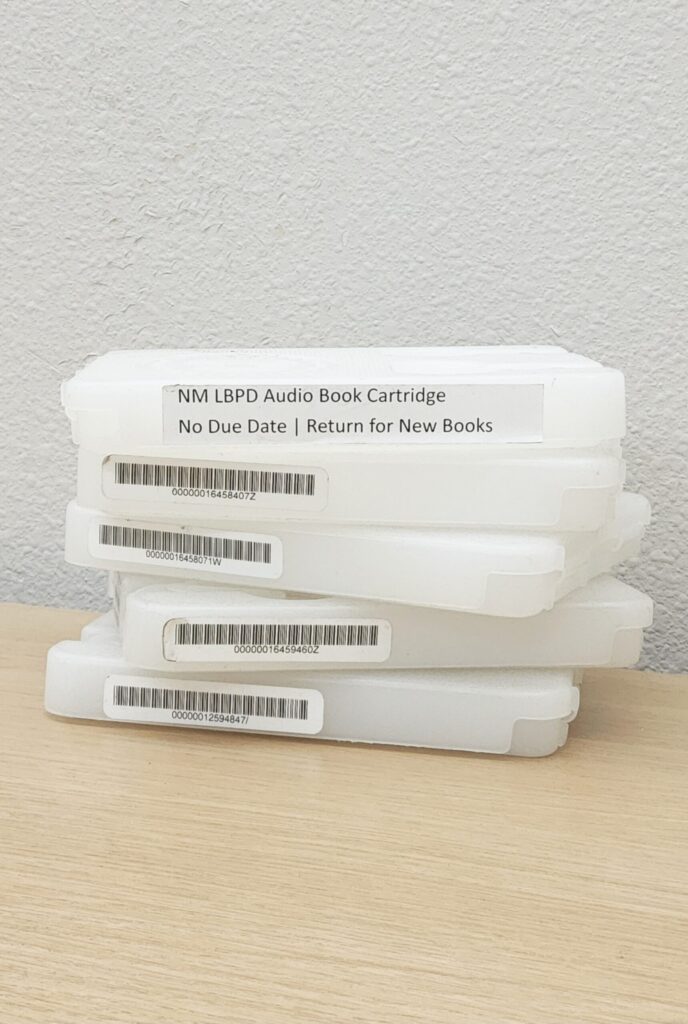 A stack of five plastic cartridge cases