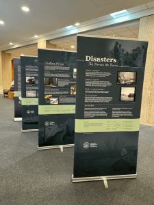 Four banners on display in a interior setting. 